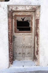 Old rusty warn door of Santorini house, Greece