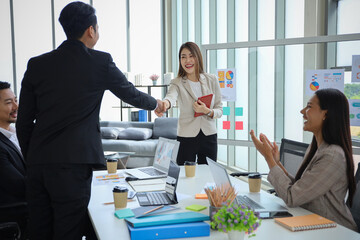 Business people relax meeting in office by using laptop computer and discussion or brainstorming