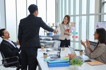 Business people relax meeting in office by using laptop computer and discussion or brainstorming