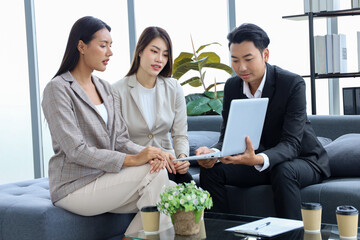 Business people relax meeting in office by using laptop computer and discussion or brainstorming