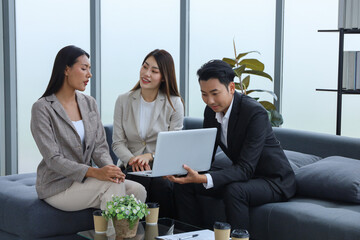Business people relax meeting in office by using laptop computer and discussion or brainstorming