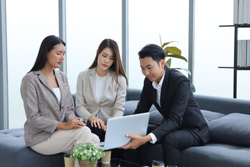 Business people relax meeting in office by using laptop computer and discussion or brainstorming