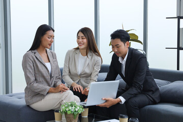 Business people relax meeting in office by using laptop computer and discussion or brainstorming