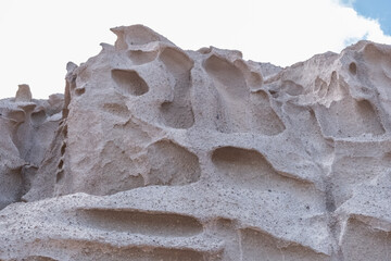 Amazing texture of the sandstone cliffs of Santorini island, Greece.
