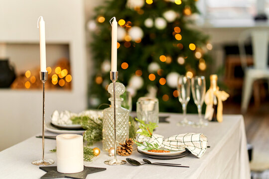 Light festive Christmas interior, set table for a festive dinner