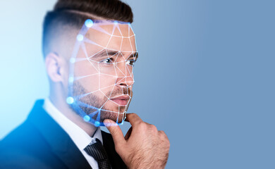 Serious businessman touching chin with facial recognition by dig