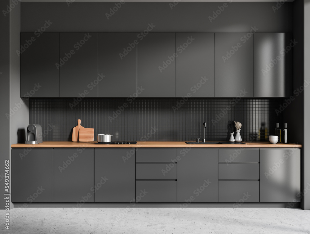 Wall mural front view on dark kitchen room interior with grey wall