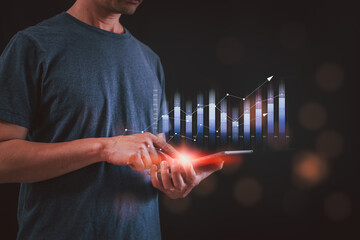 planning and strategy, Stock market, Business growth, progress or success concept. Hand of Businessman or trader touching showing a growing virtual hologram stock on smartphone, invest in trading.