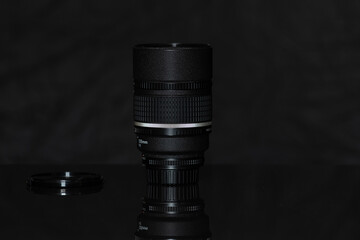 Plakat Photographic lenses on a dark background close-up.
