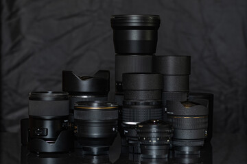 Photographic lenses on a dark background close-up.