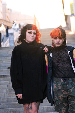 Portrait of a transgender couple with painted hair.
