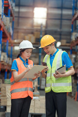 Asian engineer in helmets order and checking goods and supplies on shelves with goods background in warehouse.logistic and business export ,Warehouse worker checking packages on shelf in a large store