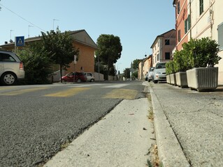 Many beautiful buildings and cars near crosswalk outdoors