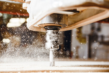 Close-up shot of cutting wood with a cnc milling machines.