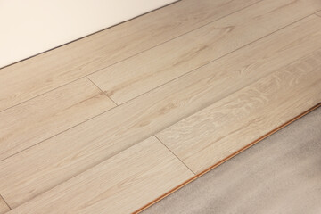 Parquet planks on floor in room prepared for renovation