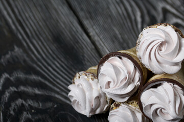 Homemade marshmallows in waffle cones. Homemade zephyr.