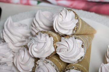 Homemade marshmallows in waffle cones. Homemade zephyr.