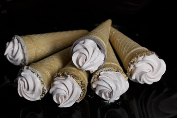 Homemade marshmallows in waffle cones. Homemade zephyr.