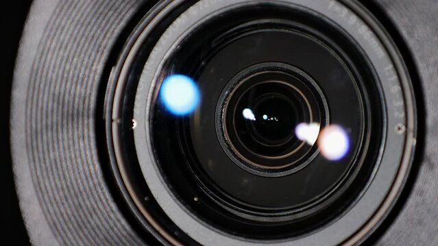 Close up of Camera Lens with Flare on Optical Glass. Process of Zooming Camera Lens