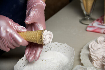 Homemade marshmallows in waffle cones. Homemade zephyr.