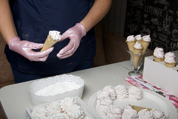Homemade marshmallows in waffle cones. Homemade zephyr.