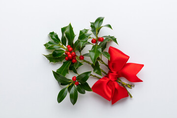 Christmas Holly Leaves and Berries on White background.