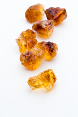 Brown caramelized sugar on white background.