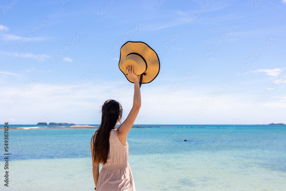 Poster woman look at the sea beach at summer time