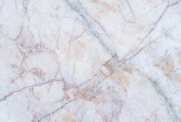 White marble background with colorful patterns  The surface is slippery and scratched.  abstract background.