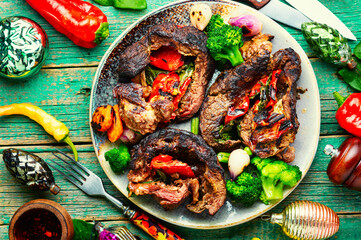 Grilled meat with vegetables.