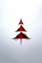 Christmas tree conceptual paper background with copy space. Merry Christmas.