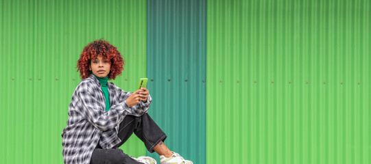 girl with mobile phone on the street