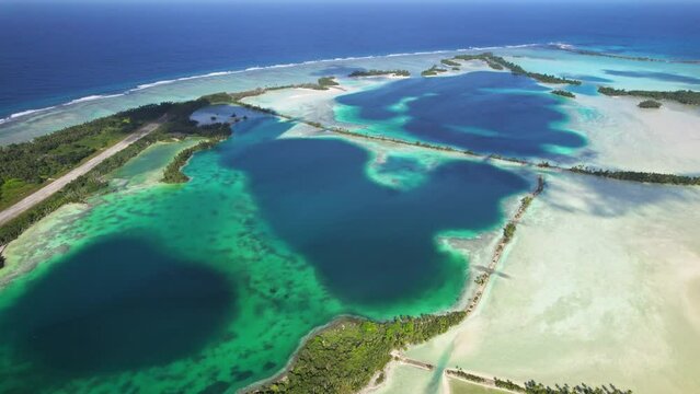 Aerial shot of man-made islands, runway, causeways and lagoon at Palmyra Atoll.