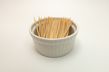toothpick in a container on a white background