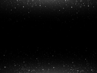 Christmas festive background of light confetti and small shining silver lights on a black background. Shiny golden texture. 