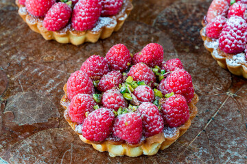 Raspberry and pistachio tarts