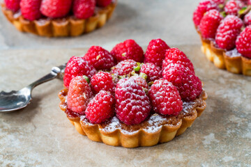 Raspberry and pistachio tarts
