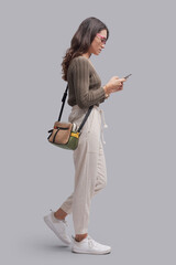 Young woman chatting with her smartphone
