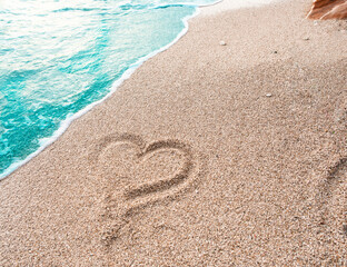 Heart drawn on the sand on the beach in Montenegro