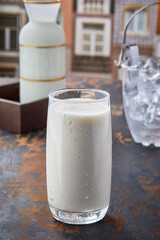 Plain Lassi served in glass isolated on table top view of punjabi culture