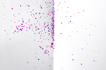 Pink and purple glitter rounds on a white background. Top view, design space
