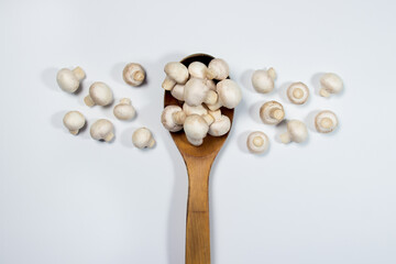 Small champignons on a white background. Mushroom variety