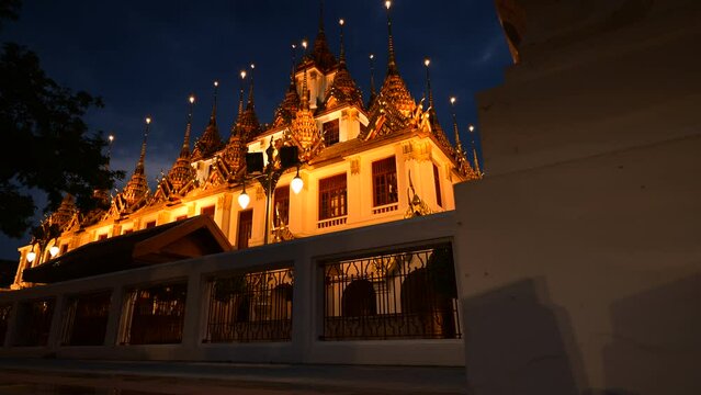4K Time lapse of Wat Ratchanatdaram and Loha Prasat Metal Castle at sunset, landmark and famous place of Bangkok city, Thailand, Footage timelapse