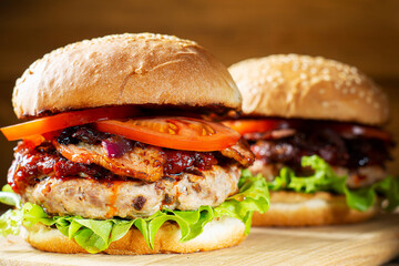 Two fresh tasty burger. Homemade hamburger with fresh vegetables, close-up