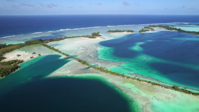 Aerial shot of tropical atoll , lagoon, man-made islands and causeways at Palmyra Atoll