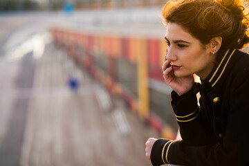 Young woman wearing a black and golden jacket