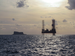 oil rig at sunset