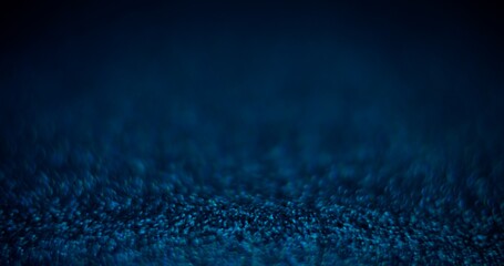 Blur color glow. Placement background. Night light flare. Defocused neon blue shiny sparkles on dark black abstract grain texture copy space wallpaper.