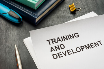 Papers about Training and development on the desk.