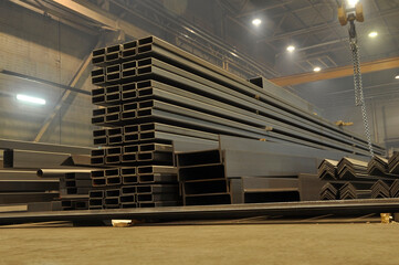 Warehousing in the workshop at the plant stock of metal I-beams profile pipes, channels.